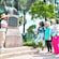 A guide talking to a group of Guests next to a statue and placard
